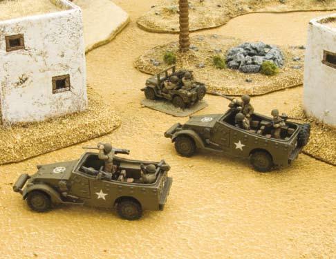 In the attack, scout ahead with your scout cars and find a weak spot in the enemy line, then blast it with machine-gun and tank fire and send in your armoured infantry to secure the objective.