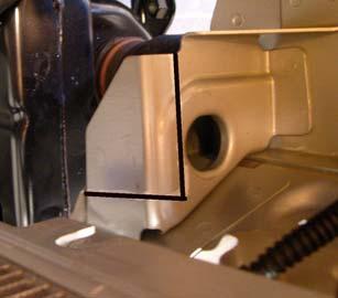 b. Driver Side: Trim lower radiator support bracket as shown.
