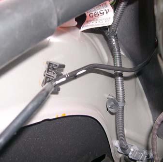 om fender well. f. Remove brake line from