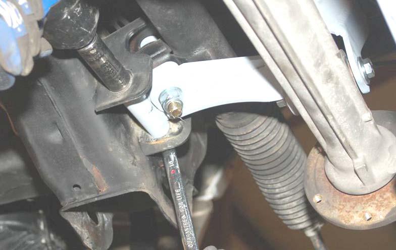 3. Raise the differential into position with a floor jack and install using the new 2mm x 00mm bolt on the passenger side. Do not install nut at this time.