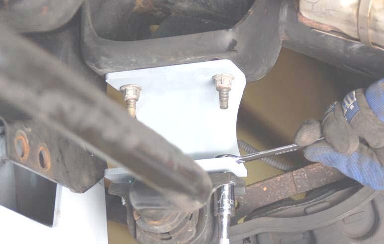 At this time tighten all cross-member bolts using a 2mm and a /6 wrench and the rear differential bolt using a 5 mm wrench. Tighten lower control arm bolts to 200 ft/lbs. 39.
