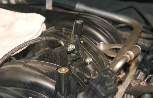 Using a 8mm socket wrench, unbolt the PCV