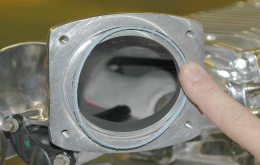 69. Install the PCV vent tube assembly into the hole in the inlet manifold.