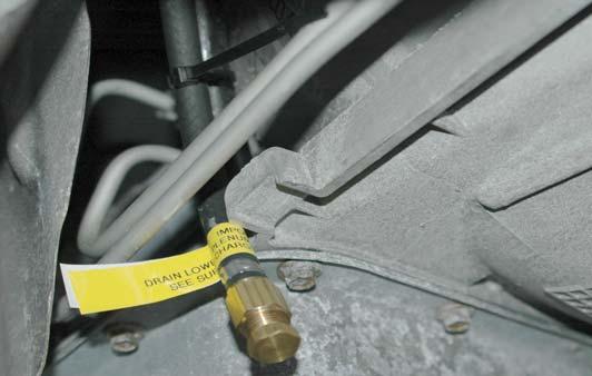 It is recommended that at every engine oil service the drain plug in the end of the hose be removed, the hose