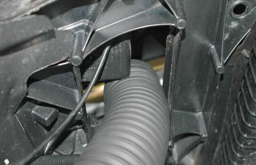 Route the air hose into the opening in the radiator