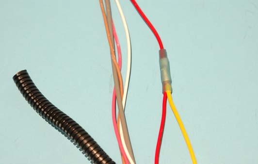 Use a crimp/shrink connector to connect the RED/ YELLOW wire to the solid YELLOW wire from the relay. 179.