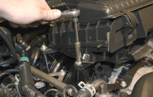 Remove the alternator cable from the anchor on the air box by