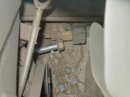 11. Remove the stock a-arm pivot bolt once the air box is out of the way and