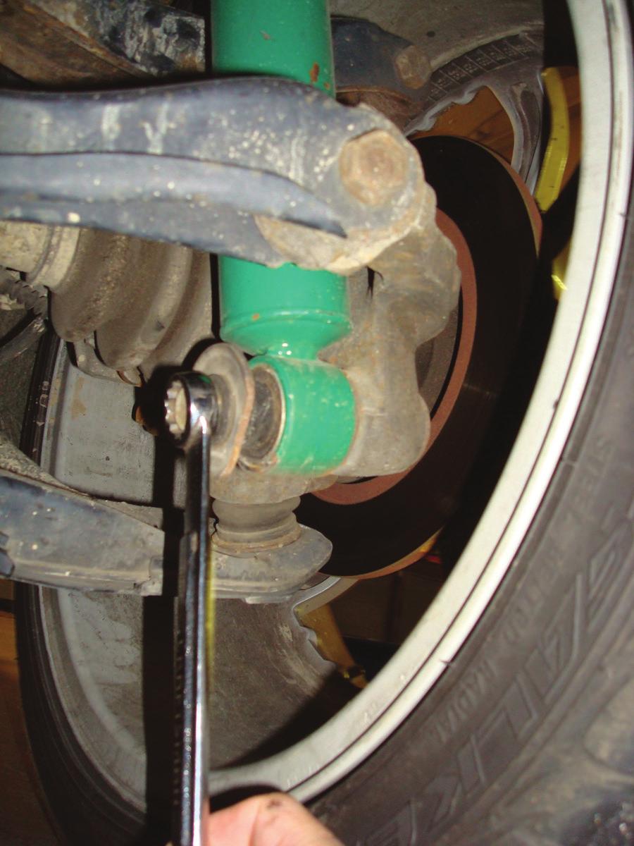 3. Remove the lower mounting bolt from the clevis or bushing (fig. 4). Remove the shock from the vehicle. fig. 4 4.