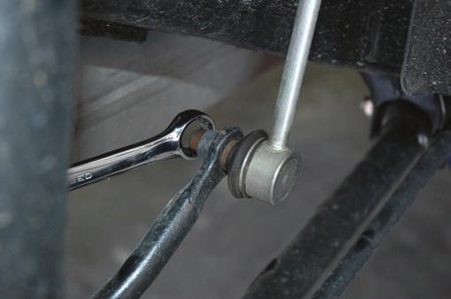 side. 6. Lower the axle and remove the factory coil spring. 7.