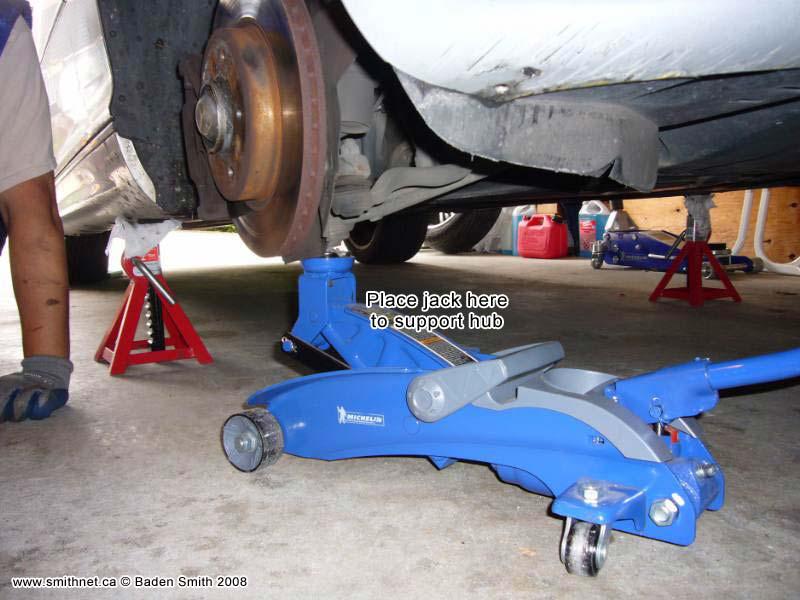 The bottom of the strut is held in place with a single 18mm bolt at the lower clamp. Remove this bolt.
