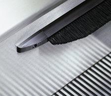 Curved brush holder sections are formed during fabrication to fit the contours of your escalator. Standard anodized aluminum brush holders are available in black or silver.