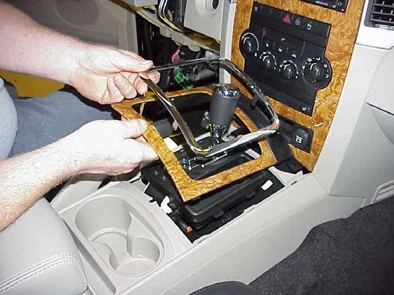 END CAP TRIM STICK 3. Remove the right and left instrument panel end caps (Figure 1). 4. Remove the passenger side hush panel and glove box assembly. DOOR PANEL Figure 1 Driver Side Shown 5.