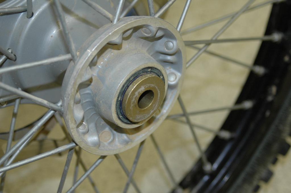 Remove the stock wheel spacers from both sides of the wheel hub and install