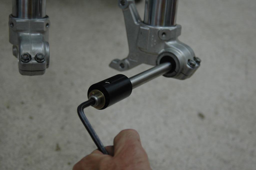 Using a 6mm Allen Wrench, attempt to turn the bushing in the discside fork fist. It should not rotate. 15.