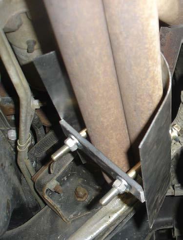 6. Place the lower air bag mount on the top of the leaf spring (the shock mount goes towards the rear of the coach). Slide the U-bolts under the lower air bag plate and fasten assembly back in place.