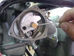Disconnect the starter cable. Remove the carburetor.