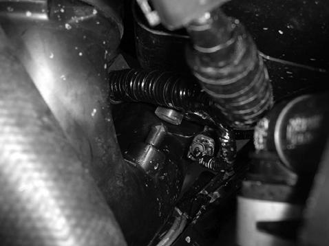 k) Pull the upper intake tube out of the grommet,