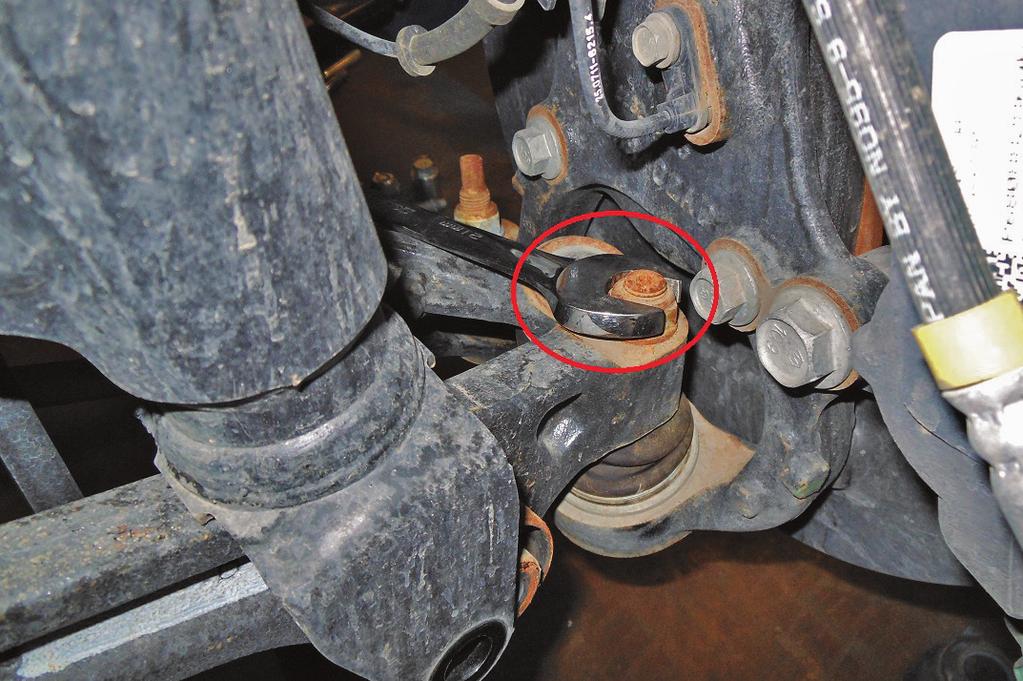 Disconnect the lower ball joint