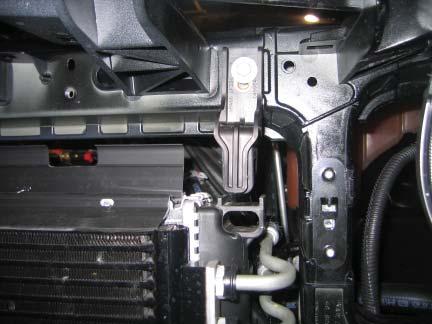 Tech Tip: At this point, the radiator will be hanging with no support. Support this using a jack/jackstands/etc.