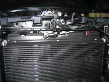 Side) 2 Remove the two 10mm bolts (one on each side of the vehicle) securing the upper radiator mounts.