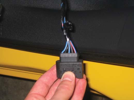 Remove the back seat, remove the fuel pump module cover (Figure 11), unplug the fuel