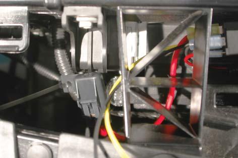Zip-tie the fuse holder to the existing wire loom on the passenger side of the