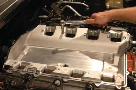 USE EXTREME CAUTION IN THIS STEP TO AVOID DROPPING BOLTS OR TOOLS INTO THE EXPOSED ENGINE