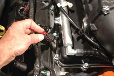 Zip-tie this harness in the stretched position to the fuel cross-over fi tting as