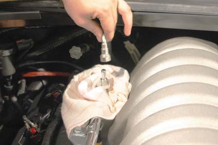 20. Disconnect the PCV vent hose from the air box and the oil fi ll spout