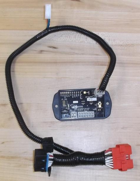 With vehicle in PARK, Park Brake ON, Ignition ON, Engine OFF, and A-1939CM550-AP module unplugged from the OBDII connector, hold a ground source to the A-1939CM550-AP modules Test Pad. 2.
