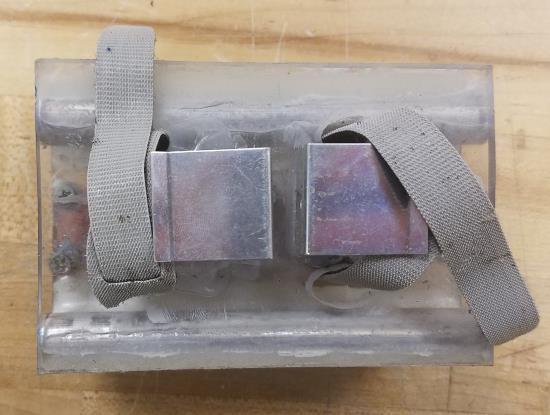The bulkhead and coupler were bonded to the body tube using epoxy and all connection surfaces. Four 1/4 in. holes were drilled for the altimeters to breathe and two 1/2 in.