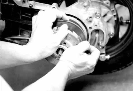 INSTALLATION Turn the driven pulley clockwise to widen the drive belt groove and lay a new drive belt on