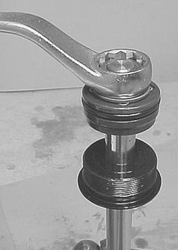 piston retaining nut from the bottom of the tilt rod