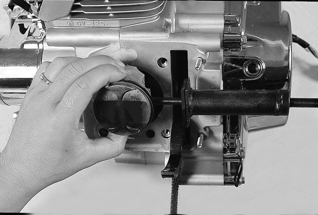 Rear cylinder Front cylinder PISTION Place a clean rag over the cylinder base to prevent piston pin