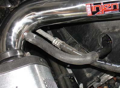 Tighten clamps on throttle body using