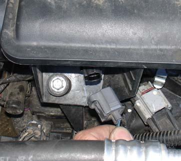 The m8 bolt is also removed from the intake resonator top(b).