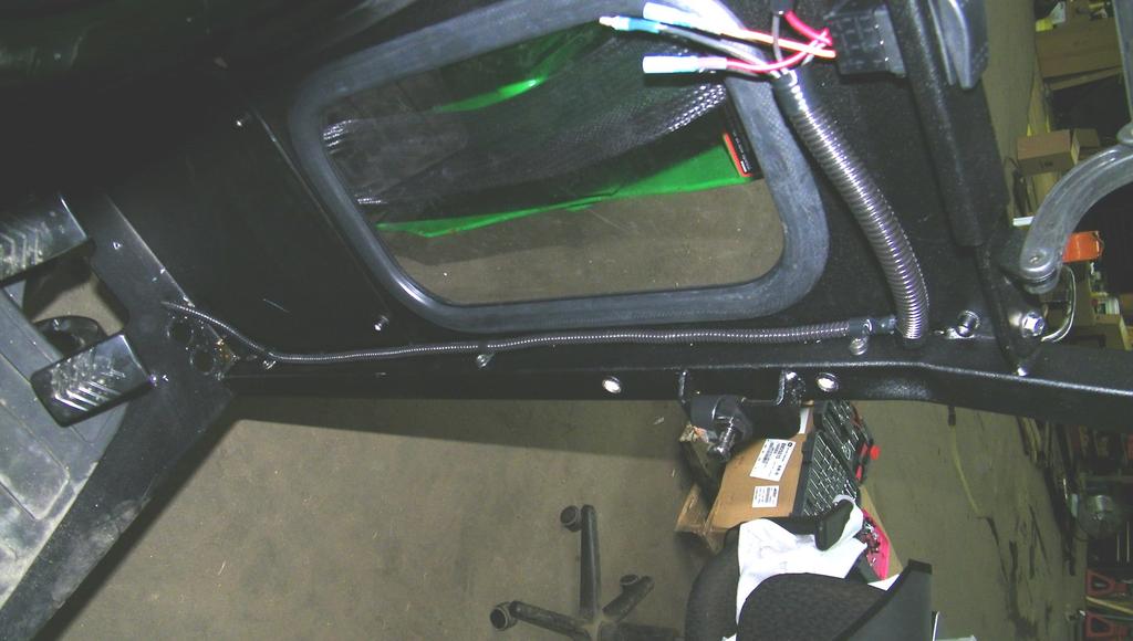 The switch may be installed in either direction, and can be removed and rotated 180 later if desired. 13.3 Connect the wiper motor and heater switch to the harness. 13.4 Open the windshield and secure the wiring harness underneath the cowl using cable clamps.