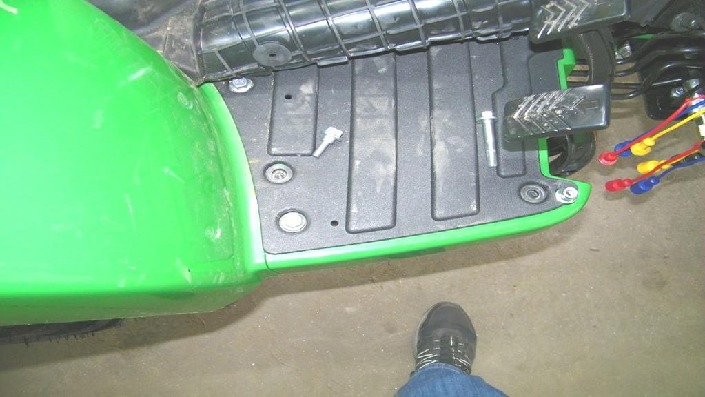 To get extra slack, a zip tie might need to be removed at the bottom of the ROPS at the back of the tractor. 1.