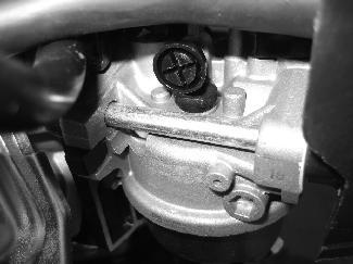 Idle speed adjustment The idle speed should be set at 1700 ± 150 RPMs To adjust the idle speed: 1. locate the idle adjustment screw (1) located on the carburetor. 2.