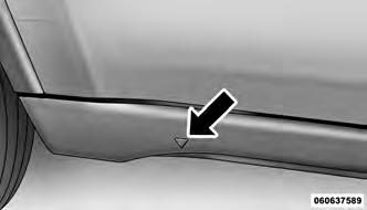 5. For a rear tire, place the jack in the slot on the rear tie-down bracket, just forward of the rear