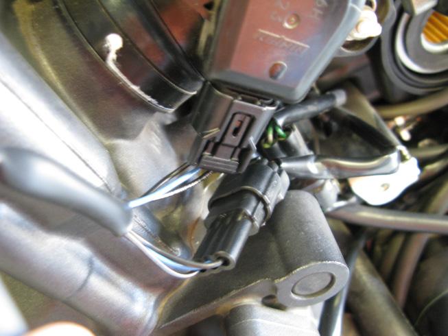5. Continue to route the fuel harness along with the factory harness, forward to the Throttle Position Sensor (TPS) sensor