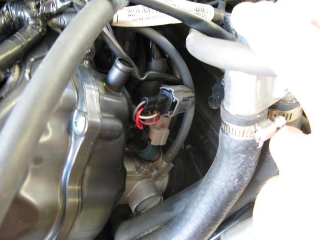 Route the remainder of the fuel harness up to the row of 4 injectors located on top of the airbox.