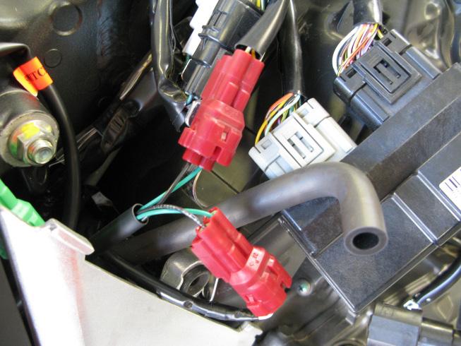 7. Now locate the red CKPS (crank position sensor) connector just to the rear of the ECU.