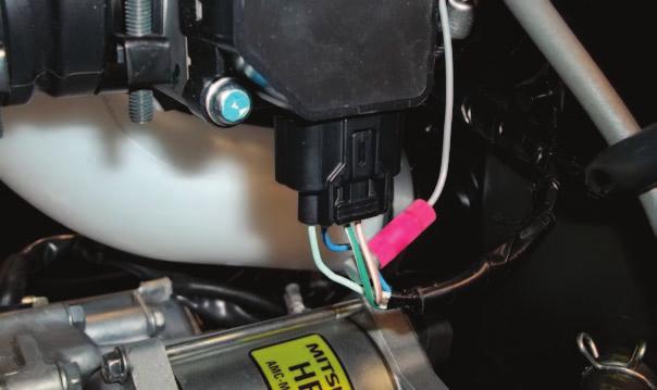 10 Just left of the airbox, locate and unplug the stock connectors for the ATV s O2 sensor (Fig. H).