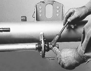 Insert the canshaft into the bearings and secure in position with the circlip.