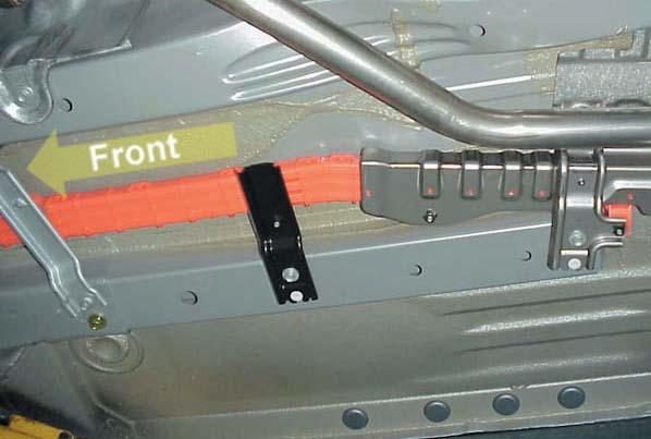 Orange Plastic Shield Undercarriage The cables are protected by a sturdy, orange plastic shield, as shown on the left.