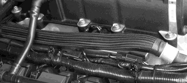 a) Install one length of protective sleeve onto the passenger side heater hose.