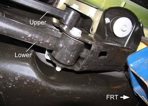 SUSPENSION ARM REMOVAL 1) Remove the lower suspension arm nut and bolt from the axle bracket. 2) Remove the flagnut at the frame rail bracket. See illustration 13. Remove the lower suspension arm. Illus.
