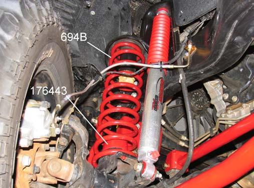 2) Install original insulator on top of coil spring 694B. Place bump stop spacer 176443 inside the coil spring. 3) Insert track bar bracket 176437B into the original track bar frame bracket.